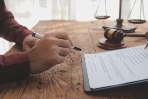 A solicitor working at their desk on the client's E scooter accident claim