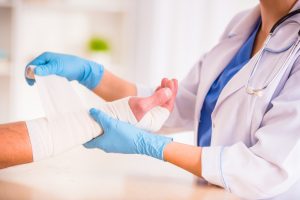 A women getting her arm plastered after suffering multiple broken wrist injuries