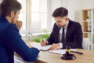 A man talking to a solicitor about his personal injury claim