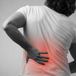 A person suffering from back pain who may use back injury compensation calculator.